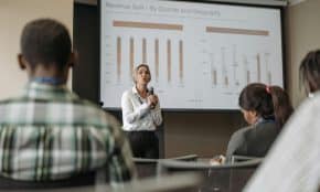 Professional presentation on revenue split by quarter and geography during a business conference.