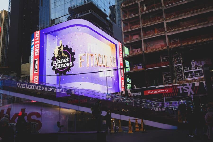 a group of people standing outside of a building