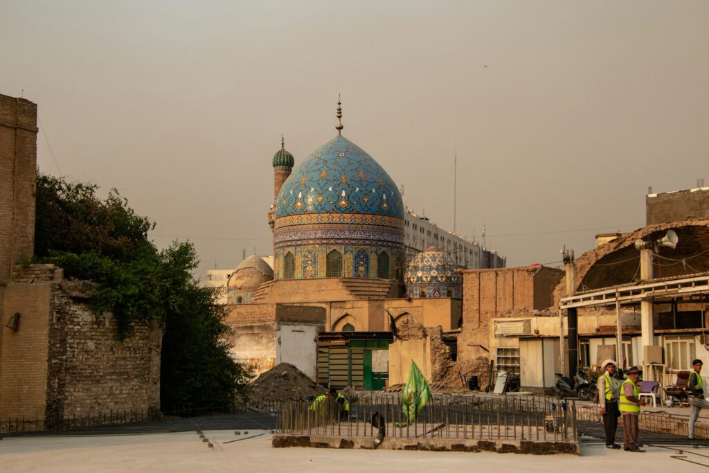 A group of people standing in front of a building