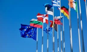 a bunch of flags that are flying in the air