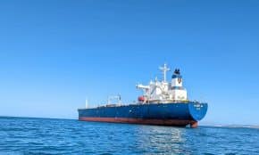 a large boat floating on top of a body of water