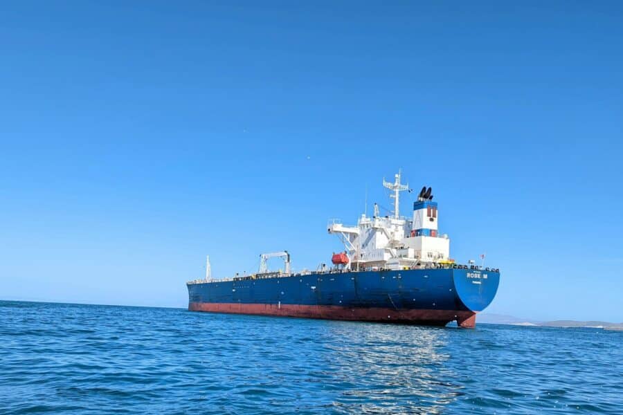 a large boat floating on top of a body of water