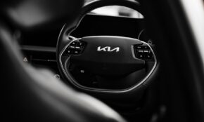 a black and white photo of a car steering wheel