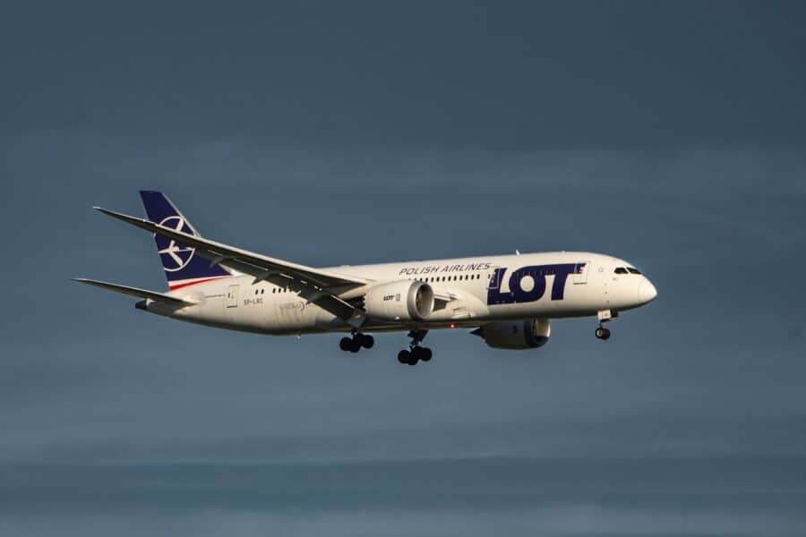 a large jetliner flying through a blue sky