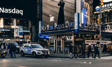 people walking on pedestrian lane near vehicles
