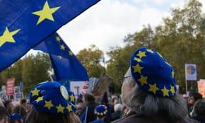 a group of people with blue and yellow hats