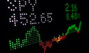 a close up of a clock with different colored numbers