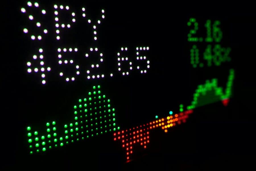 a close up of a clock with different colored numbers