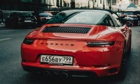 red bmw m 3 parked on street during daytime