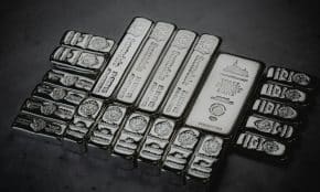 a pile of silver bars sitting on top of a table