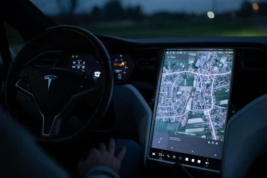 Explore the advanced touchscreen navigation in a modern electric vehicle's sleek interior at night.