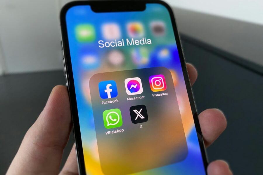 Smartphone screen social media investment scam warning