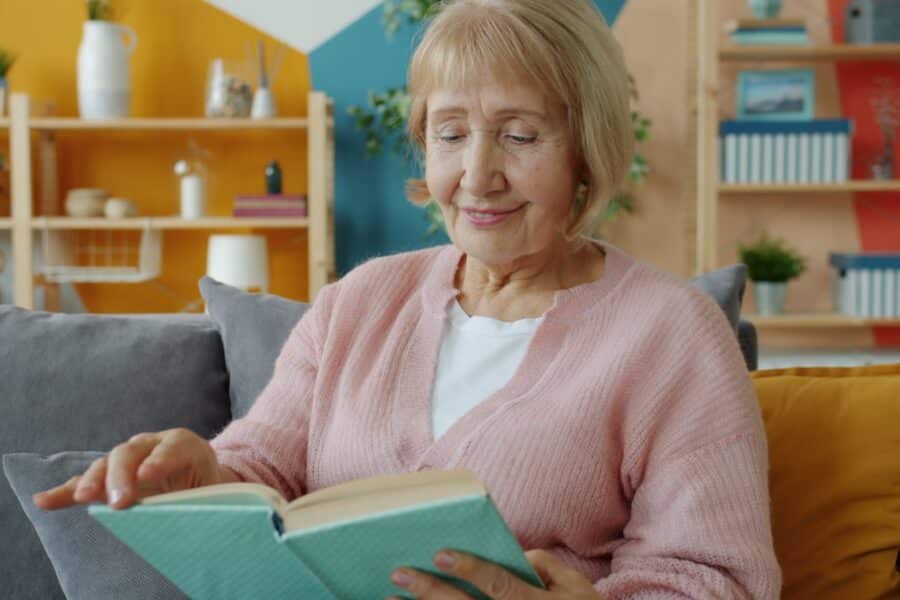 Woman reading book cozy living room