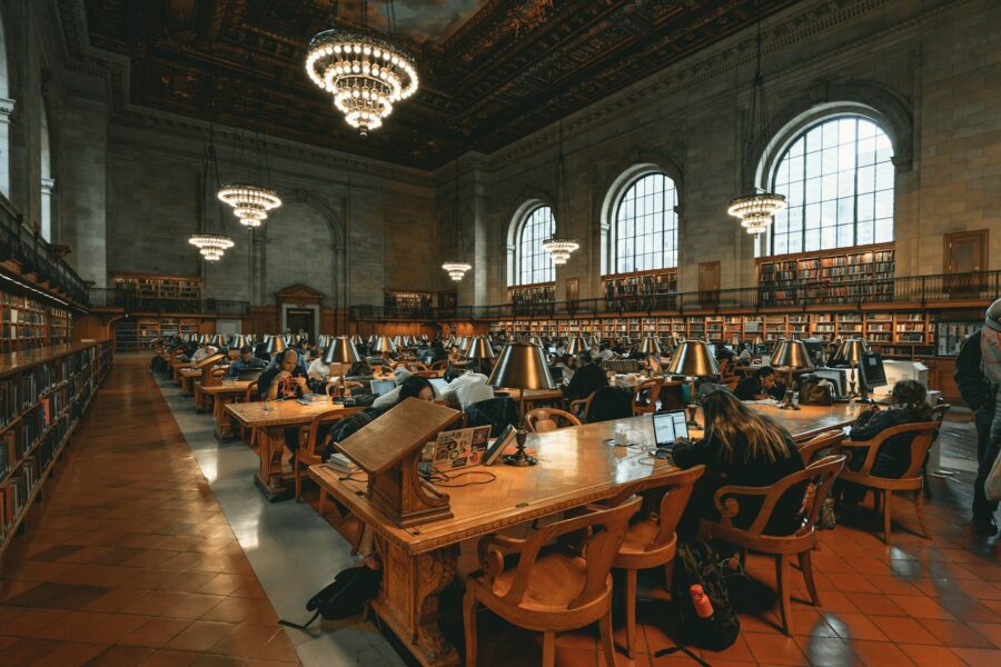 Modern public library interior people reading