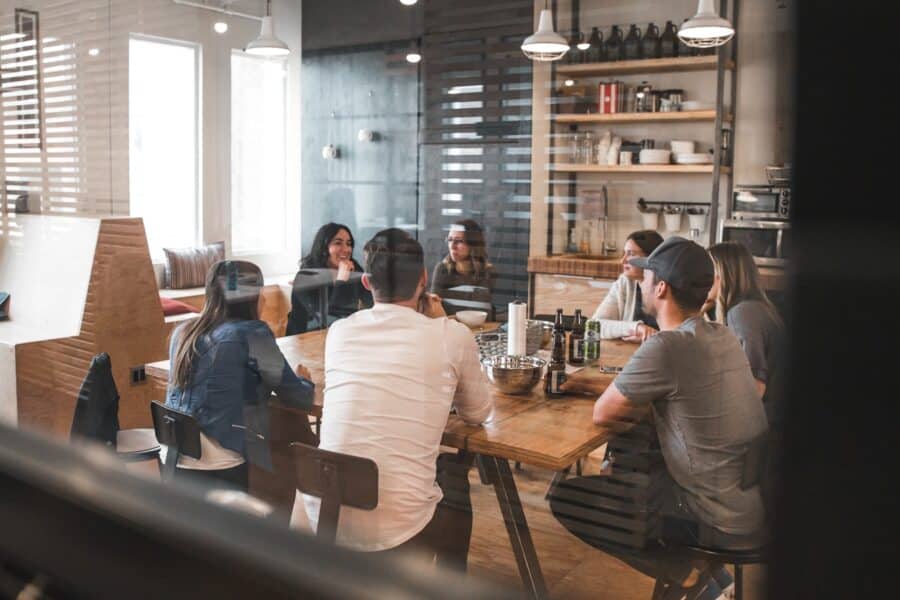 Modern office workers meeting table clock