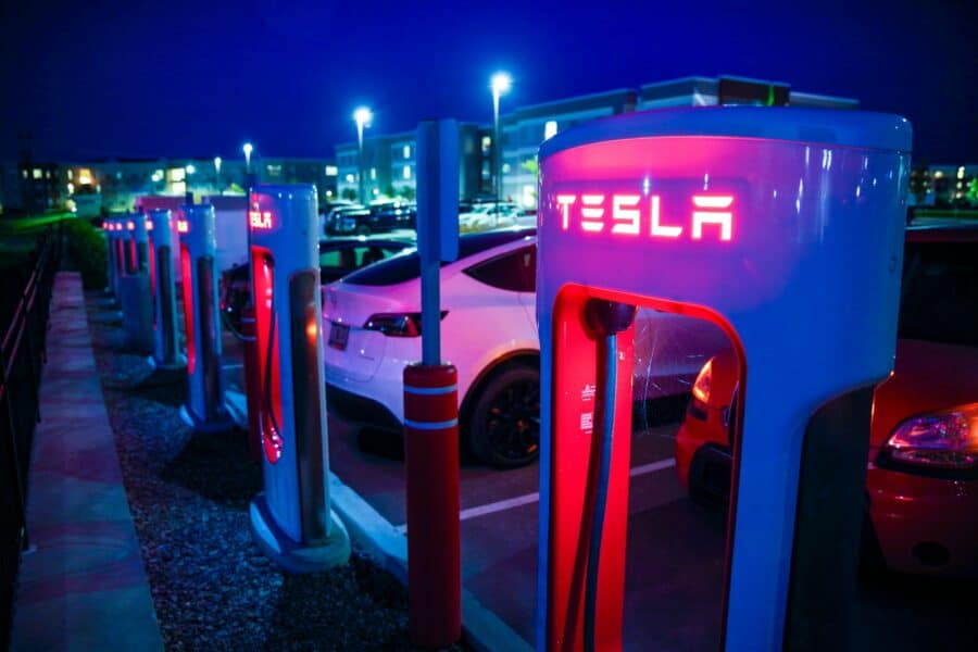 Apartment building parking electric car charging station night