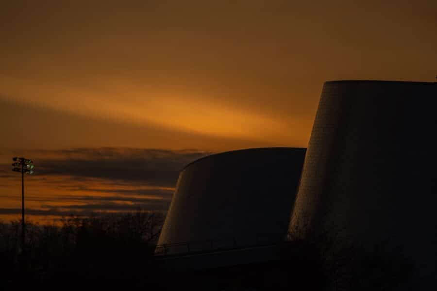 Nuclear power plant cooling towers sunset