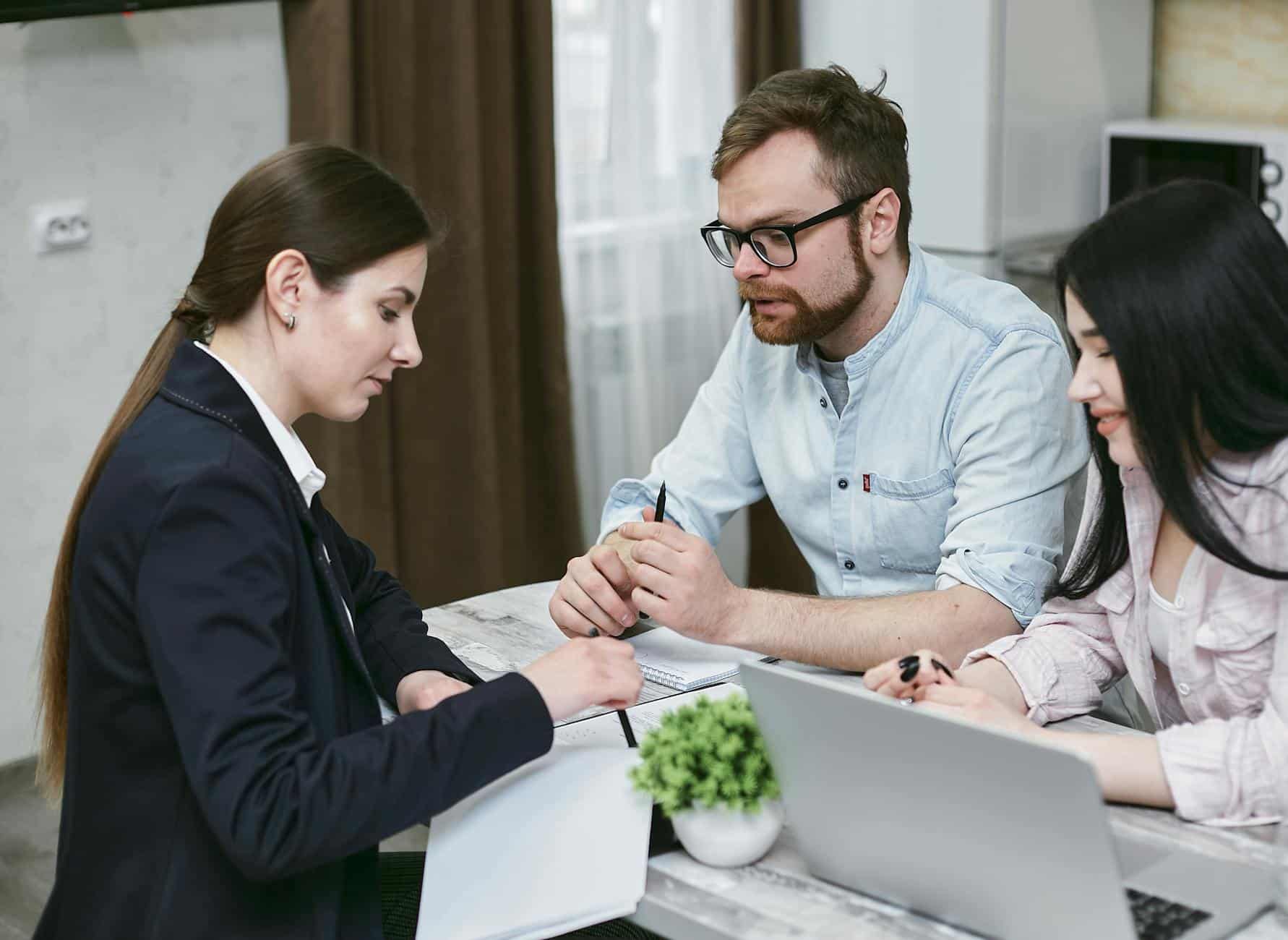 Person talking financial advisor documents