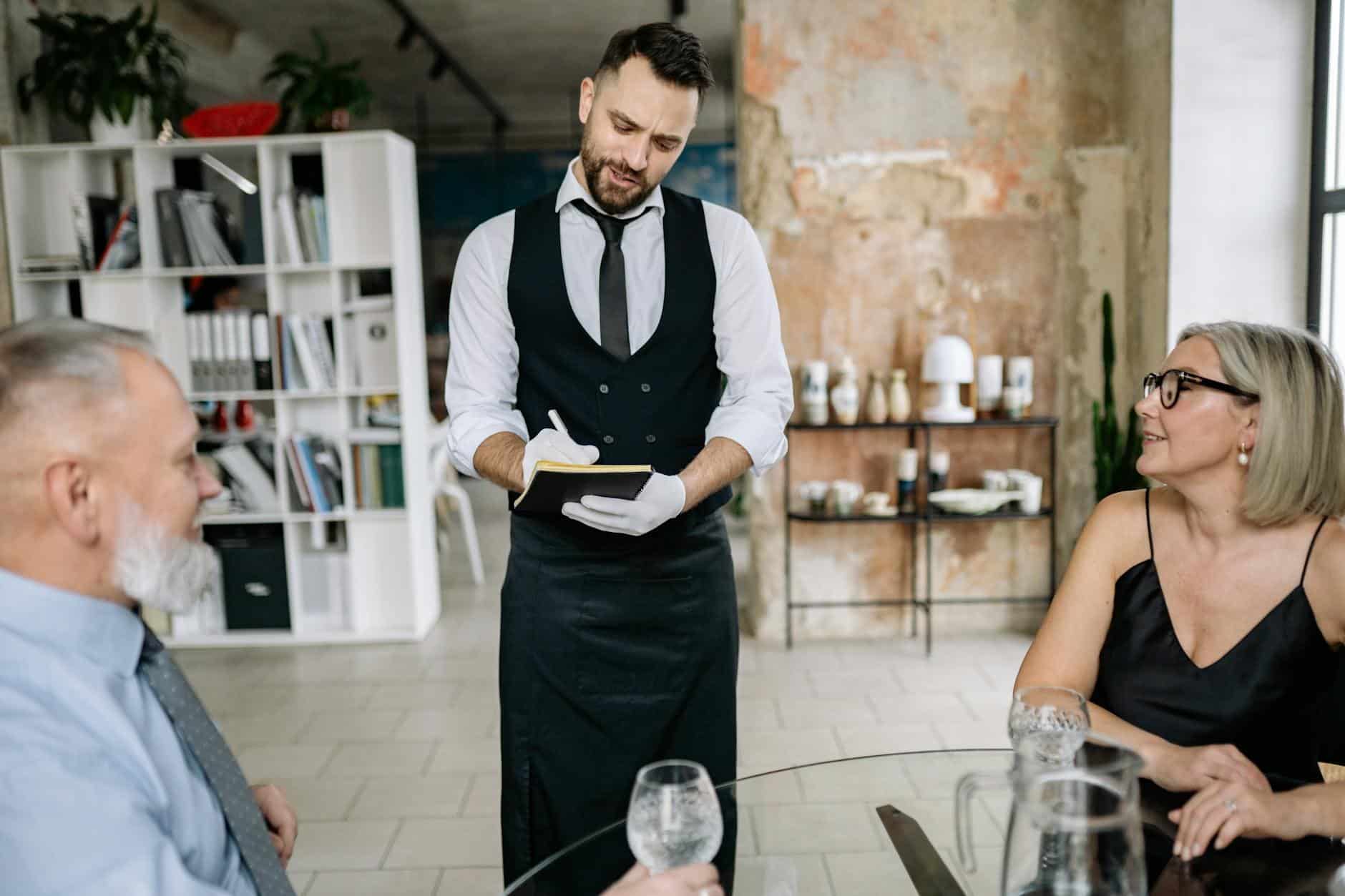 Waiter taking order code table small restaurant empty